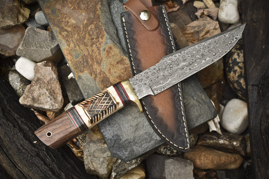 "Custom handmade 13-inch Damascus steel Bowie knife with brass guard and camel bone rosewood handle"