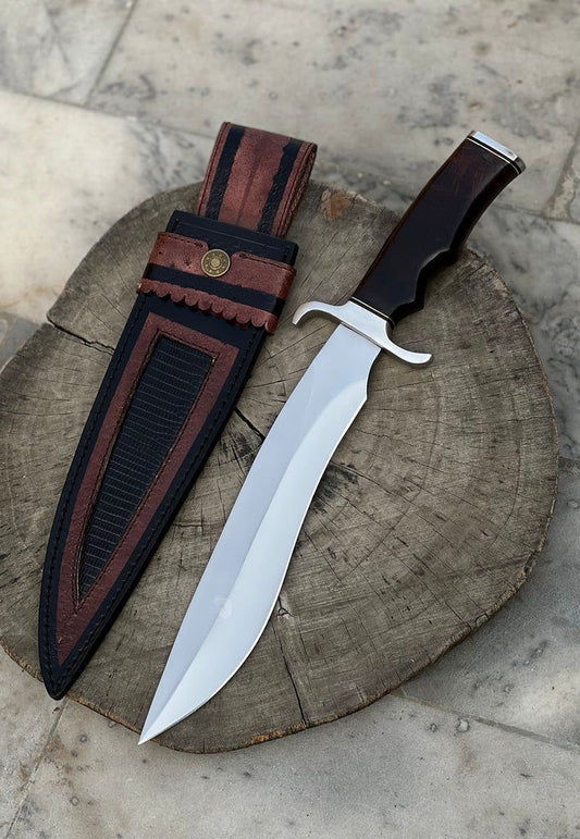 Custom handmade 16-inch D2 steel hunting Bowie knife with a rosewood handle, steel guard, and a handcrafted leather sheath