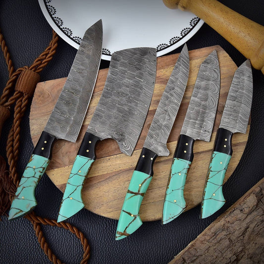 Custom handmade Damascus chef knife with a hand-forged steel blade and resin handle, showcasing a sharp edge and elegant design