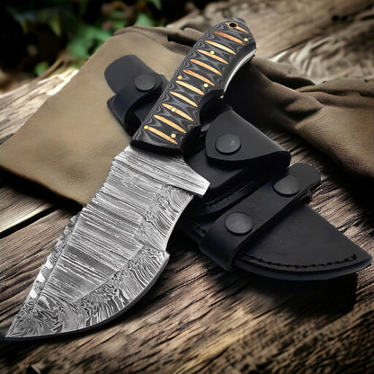 Custom handmade Damascus steel Tom Brown tracker knife with full tang and leather sheath.