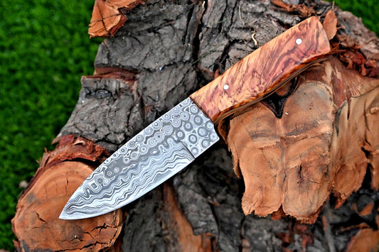 Custom handmade Damascus steel hunting knife with an olive wood handle.