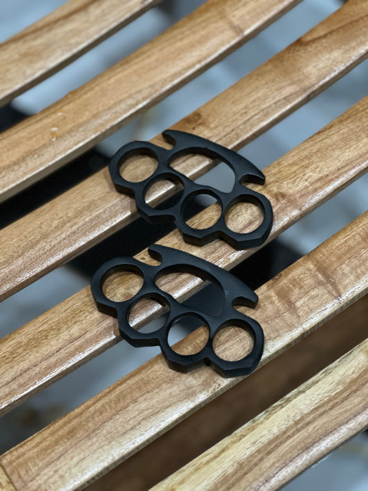 Custom handmade black steel knuckle duster with solid brass construction, paired with a belt loop leather case