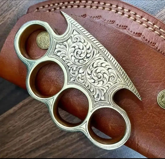 Custom handmade brass knuckle with unique engravings and leather belt loop case