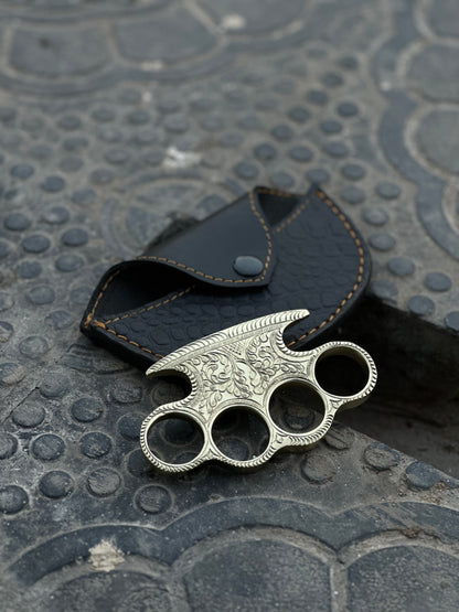 "Custom handmade engraved brass knuckles made from pure brass with intricate designs."
