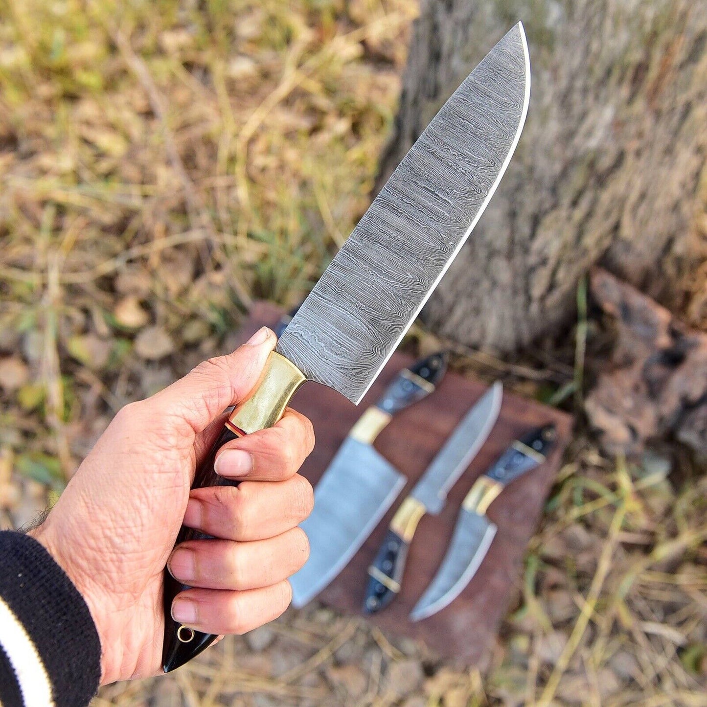 Damascus kitchen knife set with custom handmade blades and pakkawood handle detailing