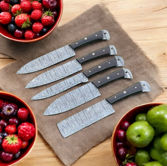 "Damascus steel knife set with Wangi wood handles and leather case"

