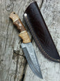 inches Damacus steel fixed blade hunting knife. Rose wood and olive wood handle.