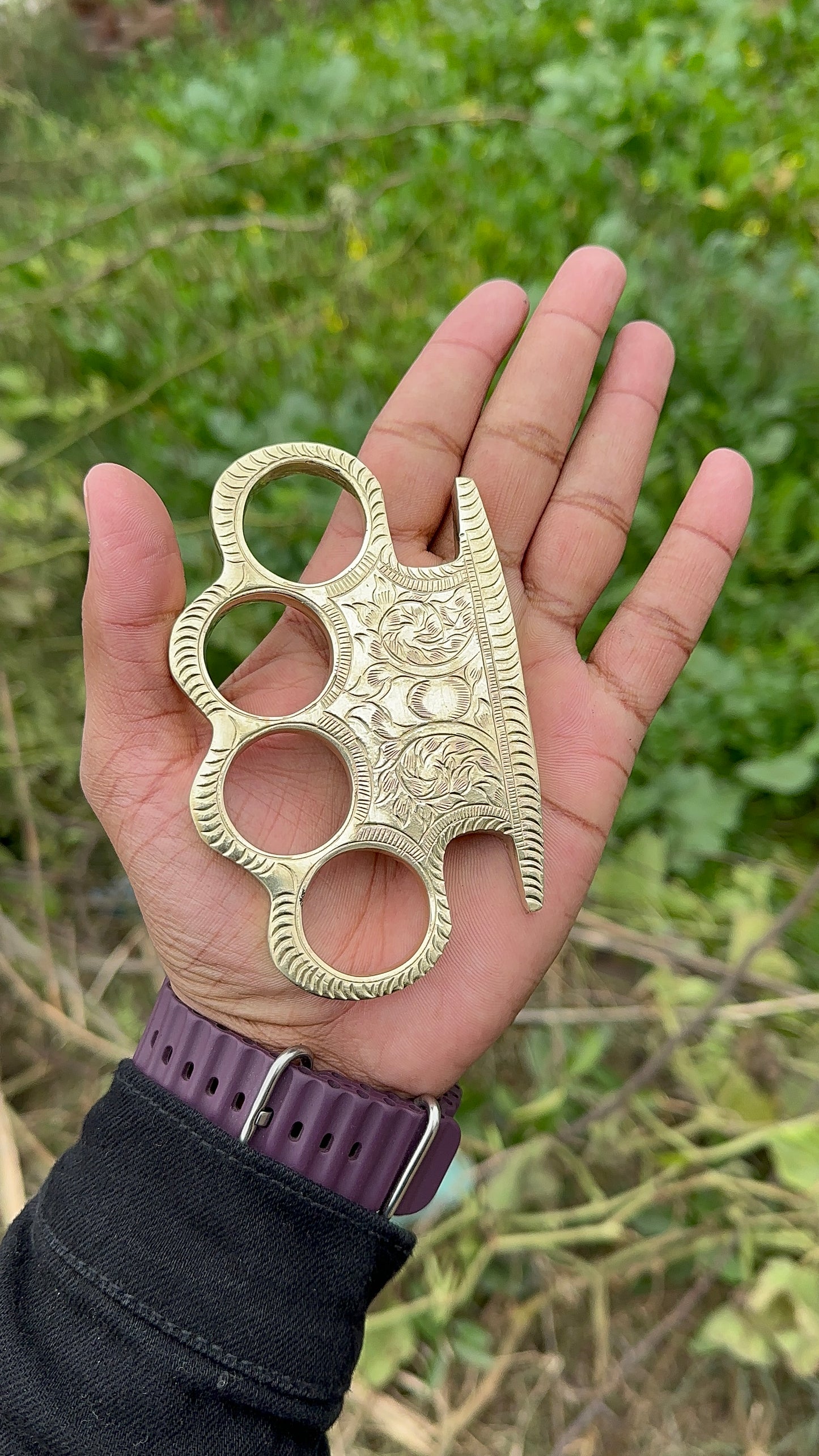 Elegant solid brass self-defense knuckle with custom engraving and leather carrying case