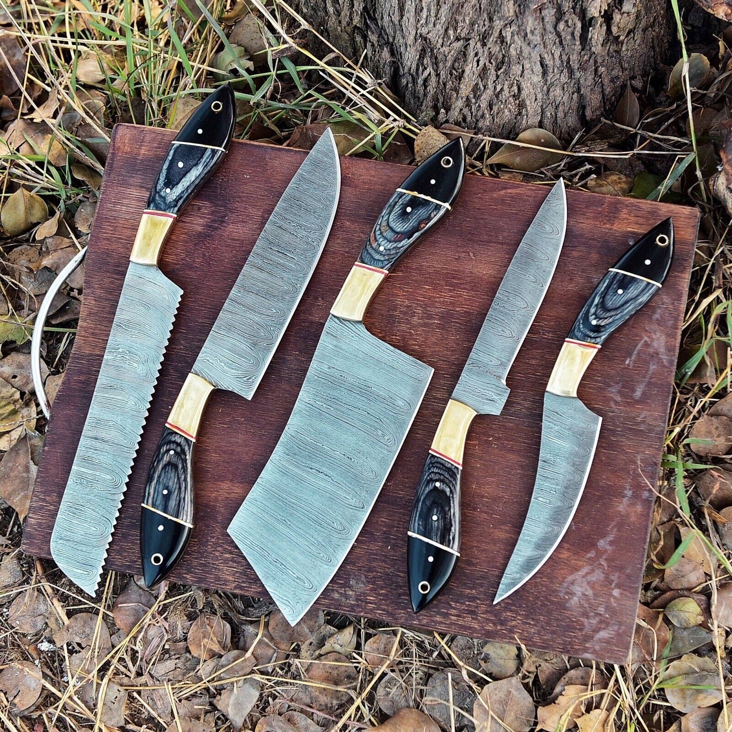 Hand-forged Damascus steel kitchen knife set with 9 to 13-inch blades and pakkawood handles