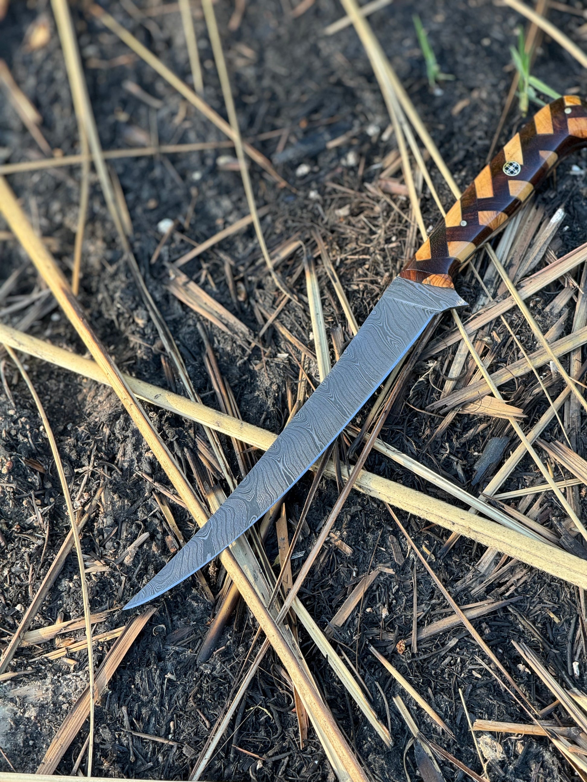 Handcrafted 13" Damascus Steel Fillet Knife with Rosewood and Olive Wood Handle, Steel Bolster, and Leather SheathHandcrafted 13" Damascus Steel Fillet Knife with Rosewood and Olive Wood Handle, Steel Bolster, and Leather Sheath