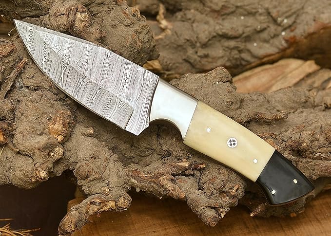 Handcrafted Damascus hunting knife with camel bone and buffalo horn handle, including a leather sheath for protection