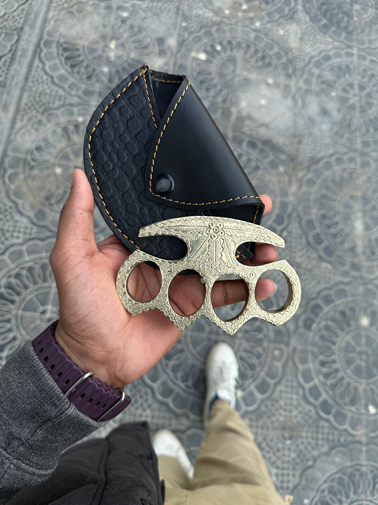 Handcrafted engraved brass knuckle with custom engraving and premium leather belt loop case