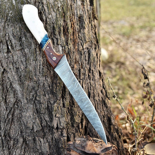 Handmade Damascus steel fillet knife with camel bone and rosewood handle, shown with leather sheath
