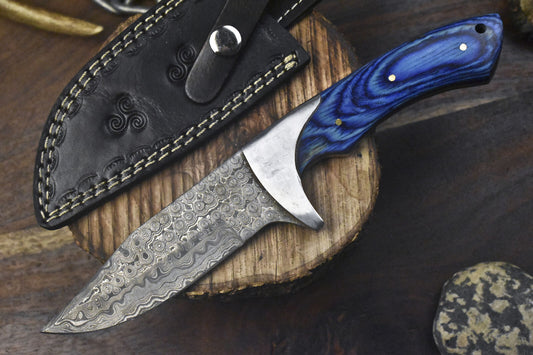 Handmade Damascus steel hunting knife with pakkawood handle and steel bolster, includes leather sheath.