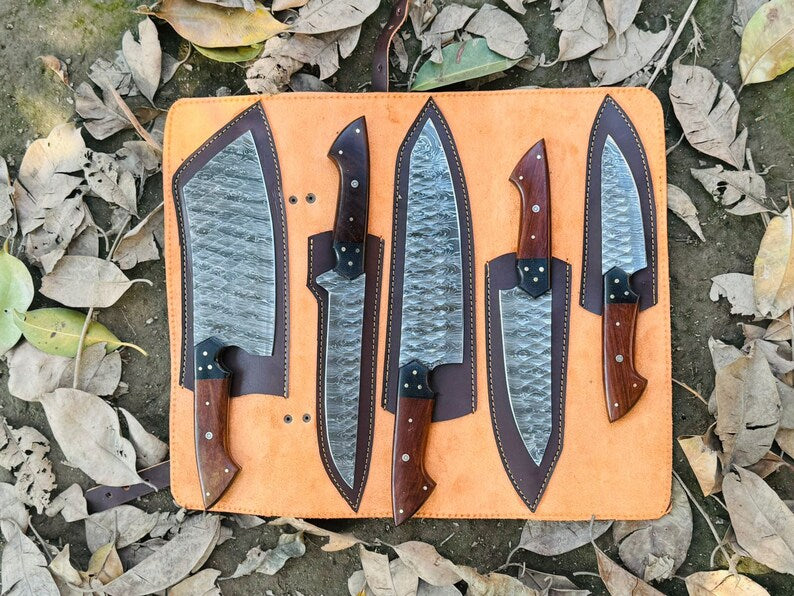 Handmade Damascus steel knives with rosewood and buffalo horn handles, perfect for chefs