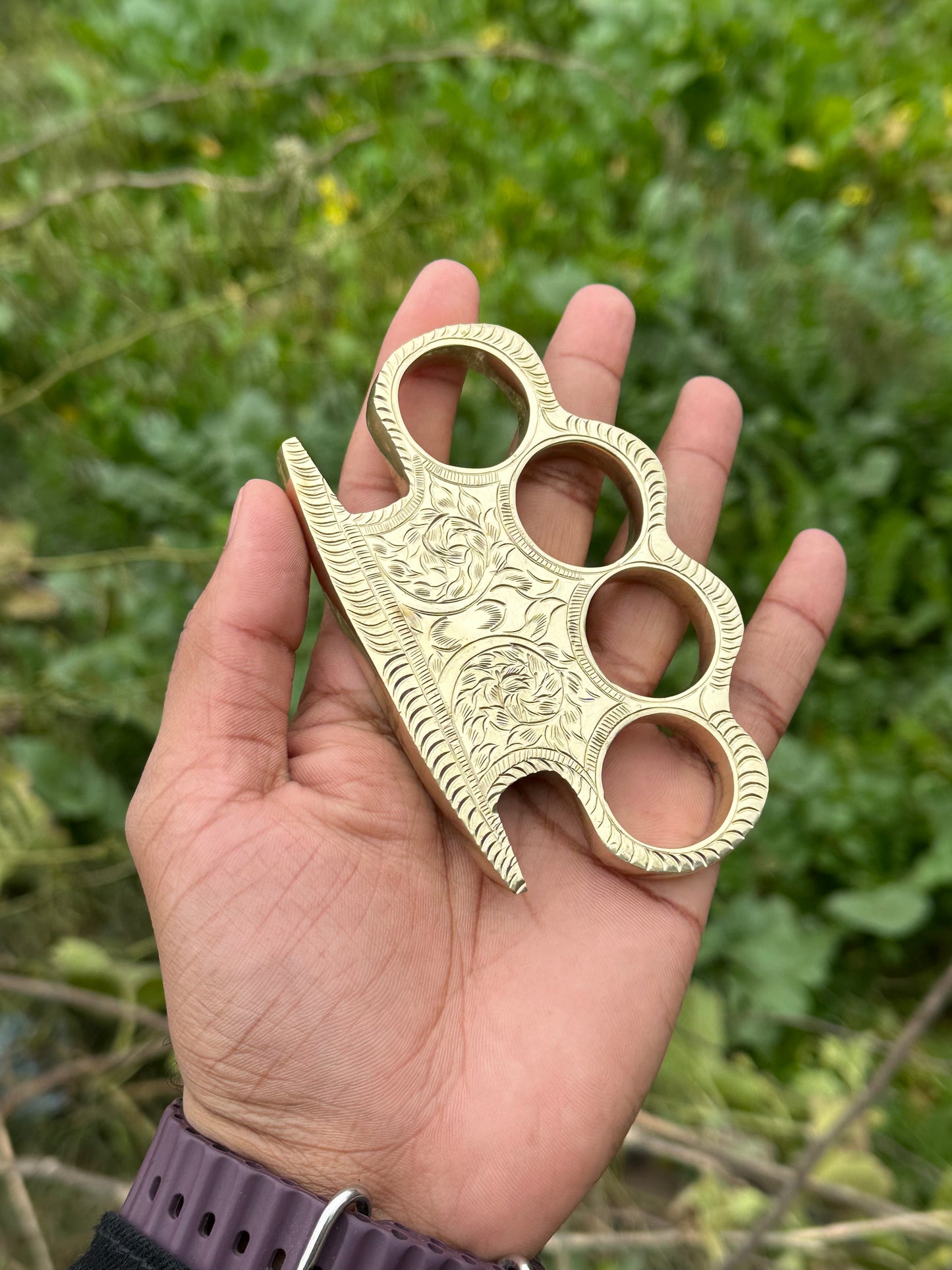 Personalized brass knuckle with custom design and high-quality leather case for everyday carry