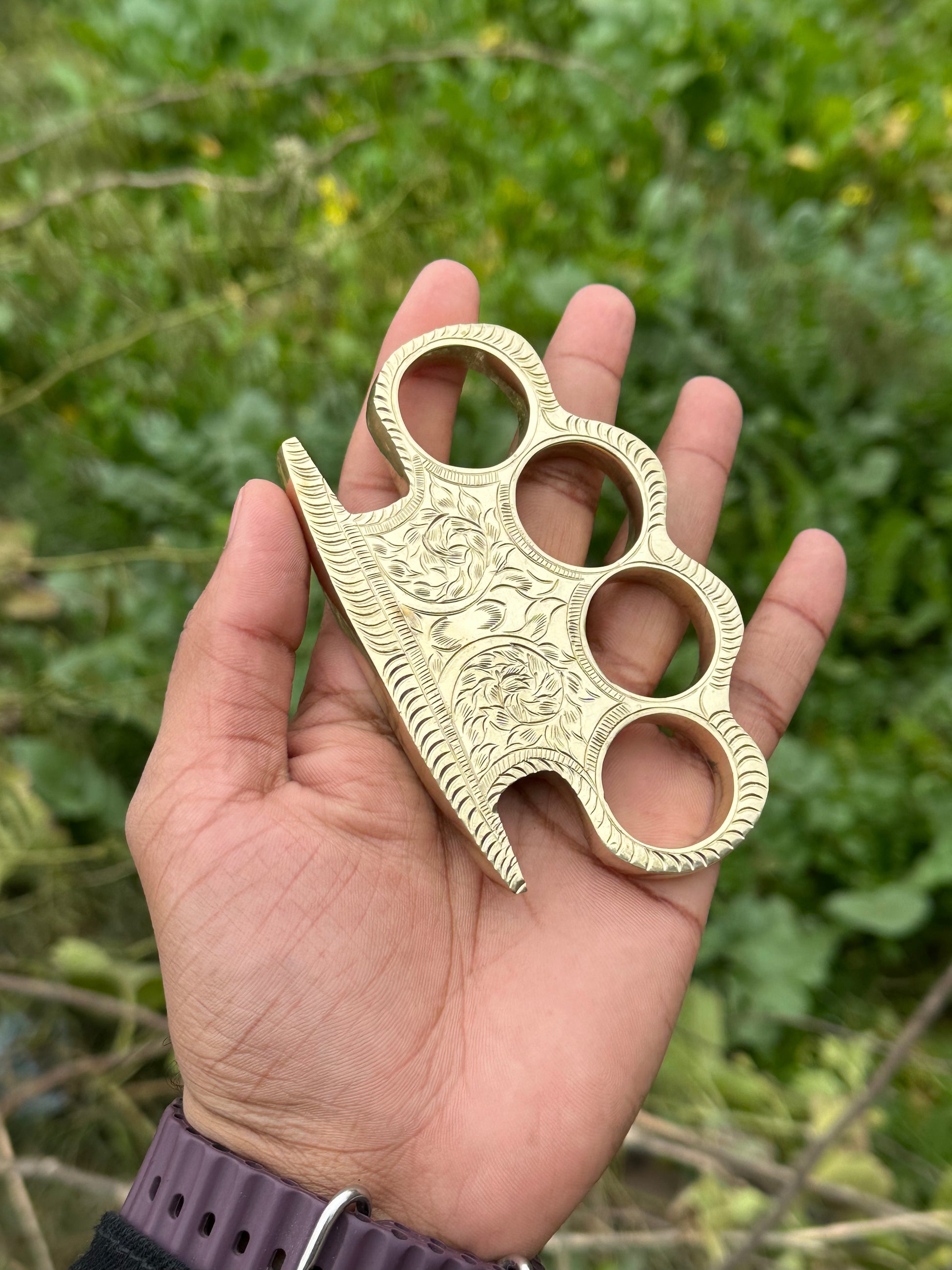 Personalized brass knuckle with custom design and high-quality leather case for everyday carry