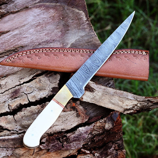 Premium Handmade Damascus Steel Fillet Knife with brass bolster and camel bone handle, displayed with a high-quality leather sheath