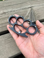 Solid steel black knuckle duster with belt loop leather case