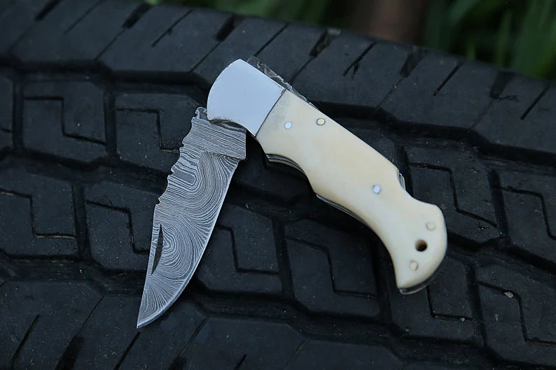 Custom handmade Damascus steel folding knife