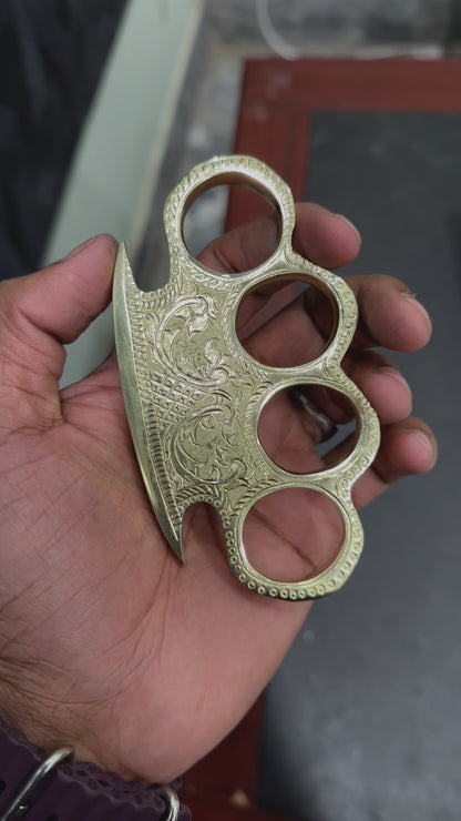 Person Wearing Custom Engraved Brass Knuckles