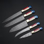 Close-up of Damascus knife set with patterned blades, camel bone, pakkawood handles, and steel bolster, ideal for chefs and kitchen enthusiasts
