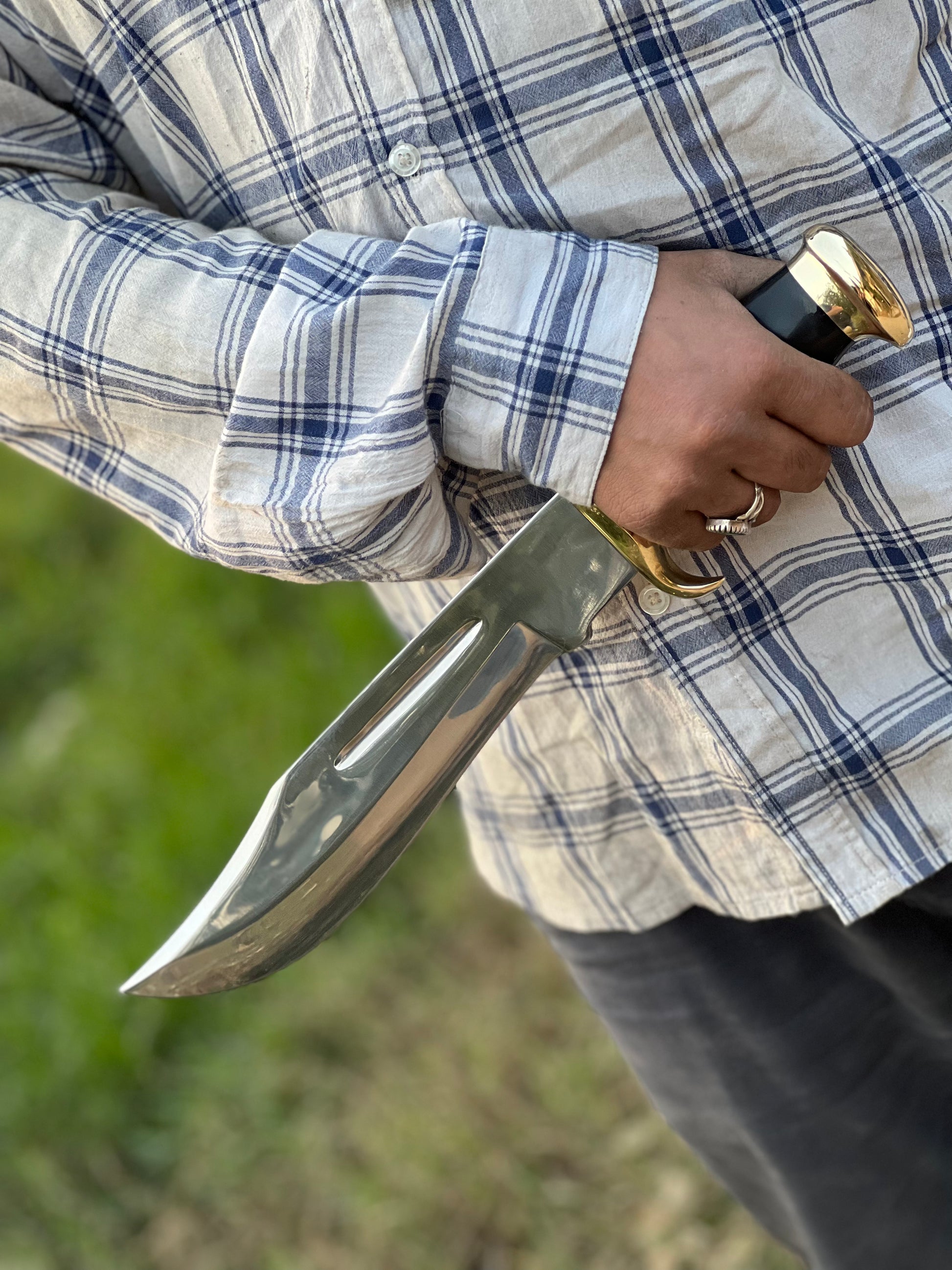 Crocodile Dundee Bowie Knife by Paul Hogan featuring a 16-inch 440C steel blade, leather and buffalo horn handle, brass guard, and beautiful leather sheath