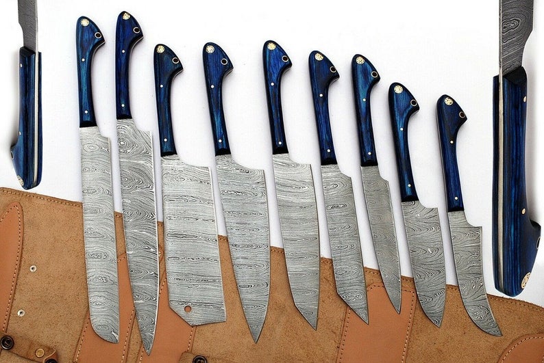 
Handmade Damascus kitchen knife set with twisted pattern blades and exotic wood handles