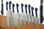 
Handmade Damascus kitchen knife set with twisted pattern blades and exotic wood handles